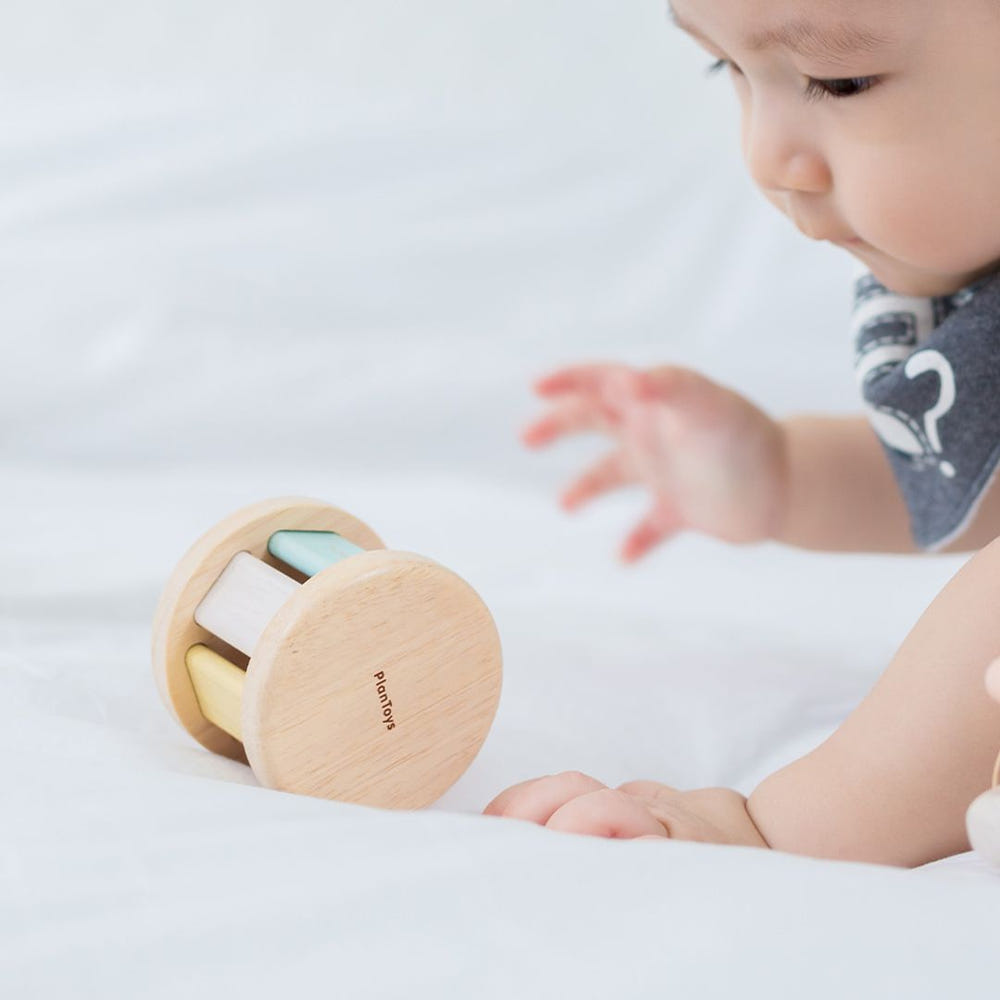 Pastel roller toy for babies, perfect for playtime and entertainment.