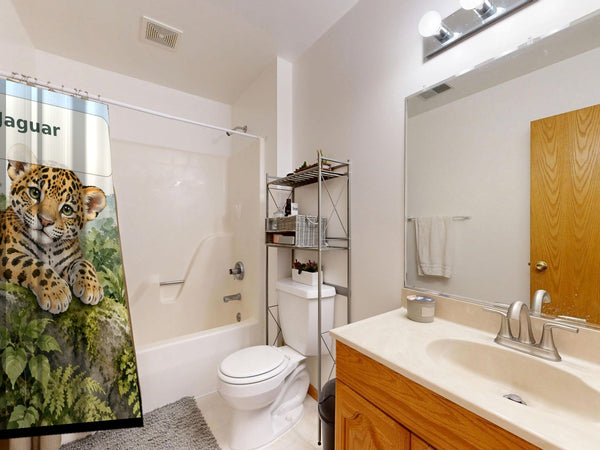 J is for Jaguar Alphabet shower curtain on a tub shower combo in an American family bathroom