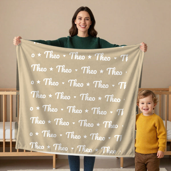 Name Pattern toddler sherpa blanket in oatmeal, held by a mom
