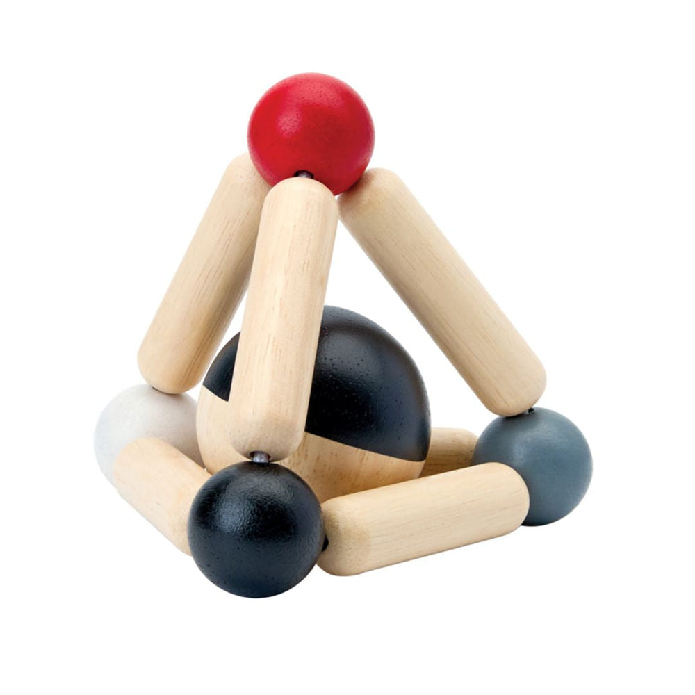 High contrast triangle clutching toy for babies, promoting sensory play and development.