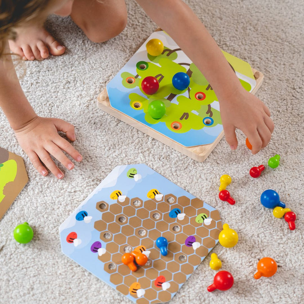 Colorful Creative Peg Board for babies, promoting fun and learning through puzzles and creative activities.