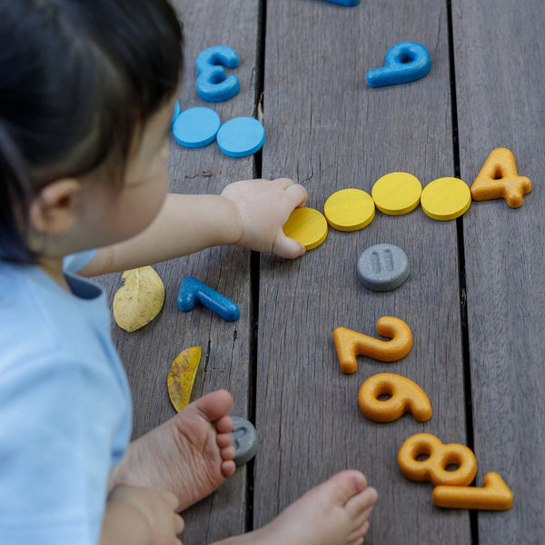 Baby furniture featuring colorful numbers and symbols, viewed from angle 2.