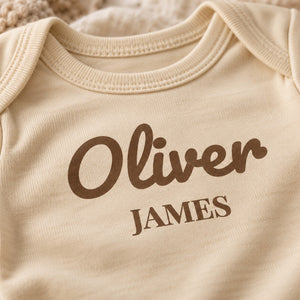 Close-up of the First and Middle Name baby bodysuit print