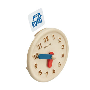 Colorful activity clock for babies, promoting early learning and sensory play, viewed from angle 9.