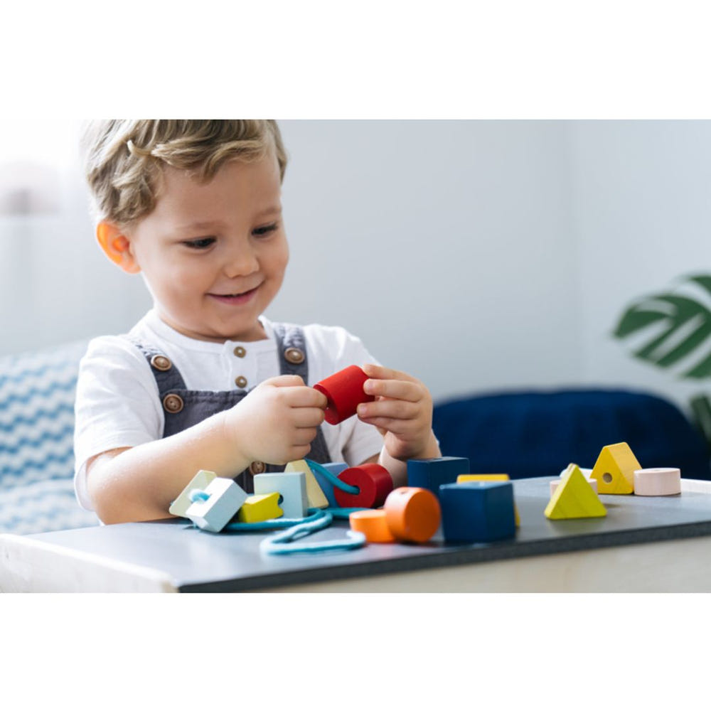 Geo Lacing Beads - Unit Plus for early learning and sensory play, featuring colorful shapes for engaging activities.