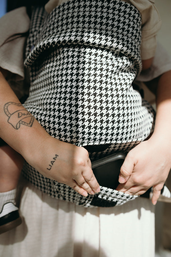 Coco Houndstooth Woven Jacquard baby carrier for 7-35 lbs, shown from angle 4, stylish and comfortable for parents.