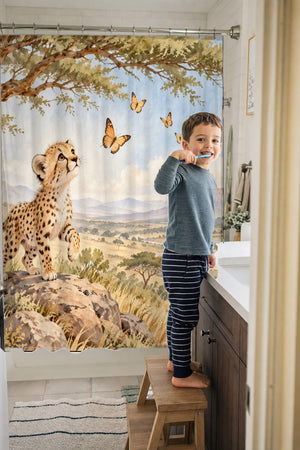 Child brushing teeth in a family bathroom with the Cheetah Cub Safari shower curtain
