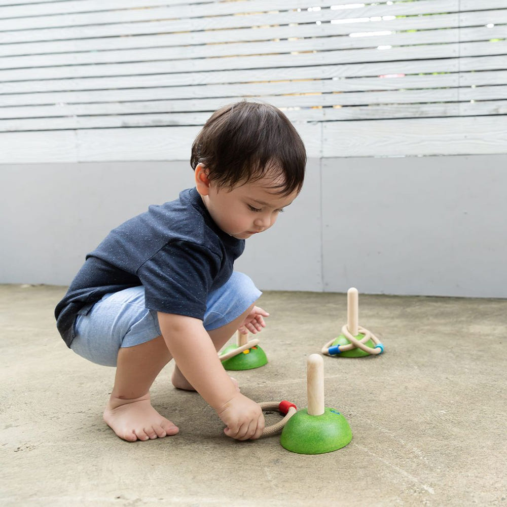 Colorful Meadow Ring Toss toy for babies, promoting fun and skill development in a playful design.