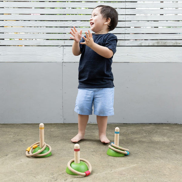 Colorful Meadow Ring Toss toy for babies, featuring vibrant rings and a sturdy base, perfect for fun and skill development.