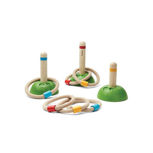 Colorful Meadow Ring Toss toy for babies, promoting fun and skill development in a playful setting.