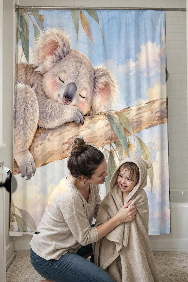 Mom drying her toddler in a hooded towel in front of the Sleepy Koala shower curtain