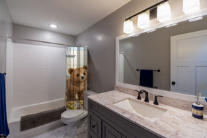 B is for Bear Alphabet shower curtain pulled open in a gray kids bathroom