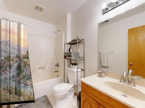 Dreamy Kingdom Fairy Tale shower curtain on a tub shower combo in an American family bathroom