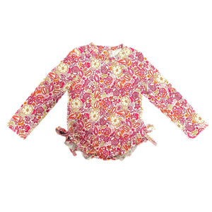 Pink seashell rash guard swimsuit for babies, perfect for fun in the sun and water play. Angle 3 view.