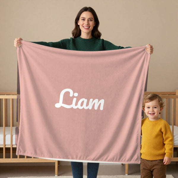 Classic Name toddler minky blanket in blush, held by a mom