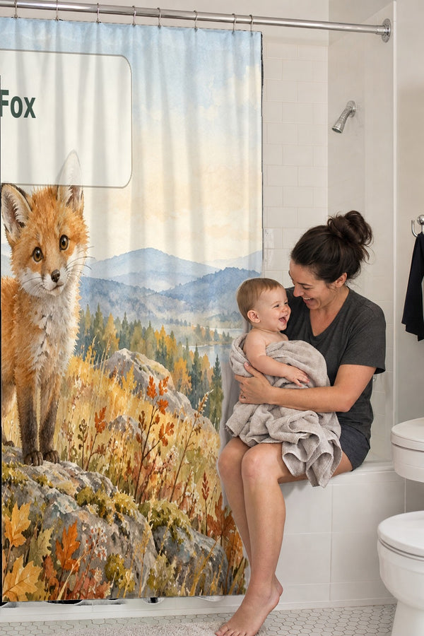 Mom holding her baby on the tub edge next to the F is for Fox Alphabet shower curtain