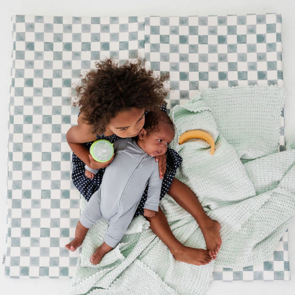 Checker Matcha Vegan Leather Mat for babies, perfect for playtime and safe, stylish flooring.