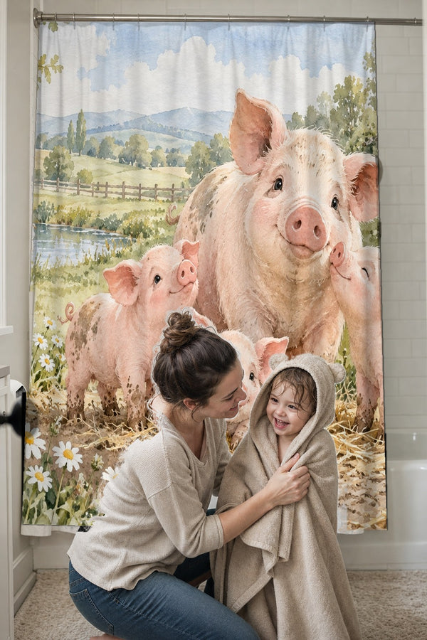 Mom drying her toddler in a hooded towel in front of the Piglet Family Farm shower curtain