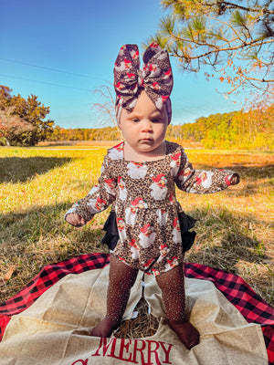 Leopard Santa ruffle romper for babies, showcasing festive style and playful design from angle 3.
