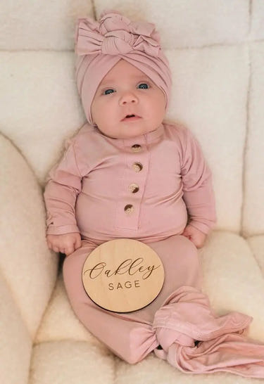 Newborn knotted gown and bow turban hat set in dusty rose for stylish baby outfits.