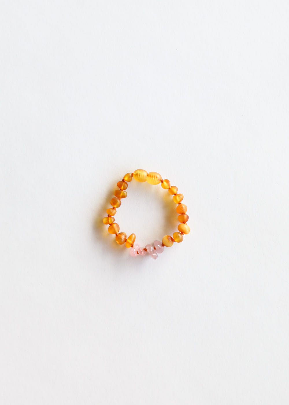 Raw Honey Baltic Amber and Raw Rose Quartz kids necklace set for babies, promoting wellness and style.