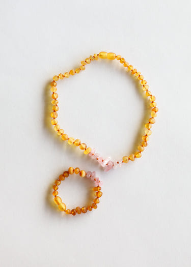 Raw Honey Baltic Amber and Raw Rose Quartz kids necklace set for babies, promoting wellness and style.
