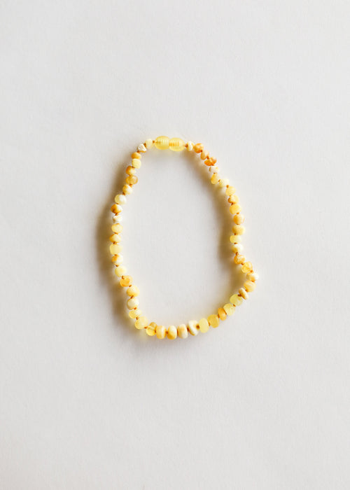 Raw Butterscotch Baltic Amber necklace for babies, showcasing a unique design from angle 3.