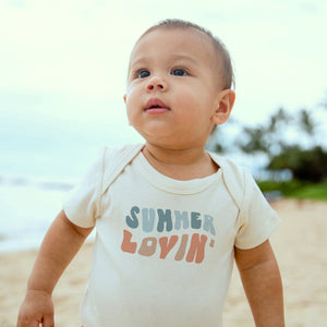 "Summer Lovin' graphic bodysuit for babies, short sleeve, angle view showcasing playful design and vibrant colors."