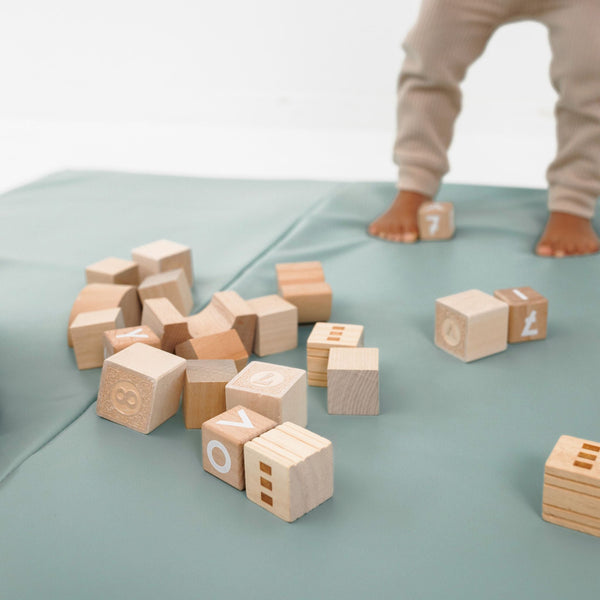 Sage Vegan Leather Play Mat at angle 9, perfect for stylish and safe baby playtime.