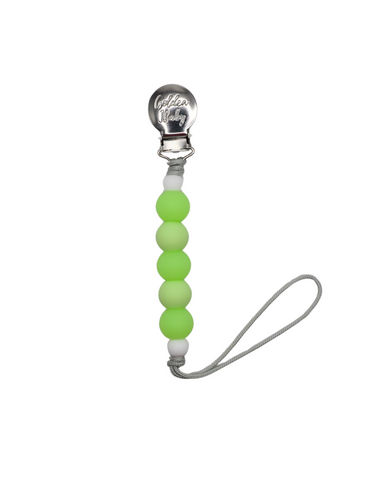 Glow in the dark green pacifier clip for babies, ensuring comfort and visibility at night.