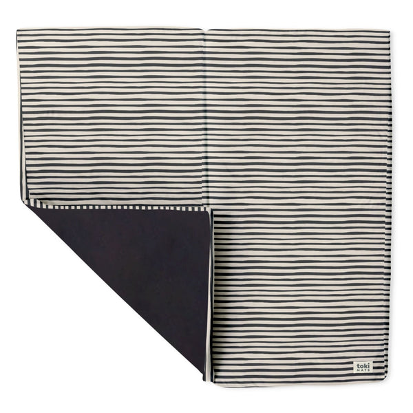 Bold Stripe Organic Cotton Mat for babies, featuring vibrant colors and a soft texture, perfect for playtime.
