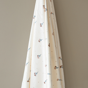 Minky Stretch Luxe Swaddle Blanket in soft fabric, perfect for cozying your baby. Angle 3 view.