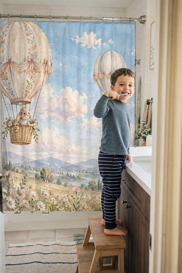 Child brushing teeth in a family bathroom with the Meadow Hot Air Balloons shower curtain