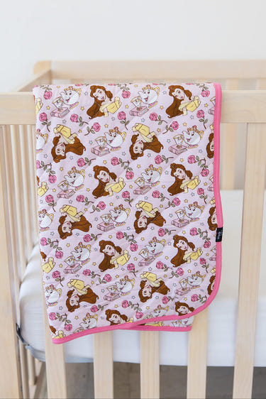 Provincial Petals quilted baby blanket in soft pastel colors, perfect for cozy sleep and stylish nursery decor.