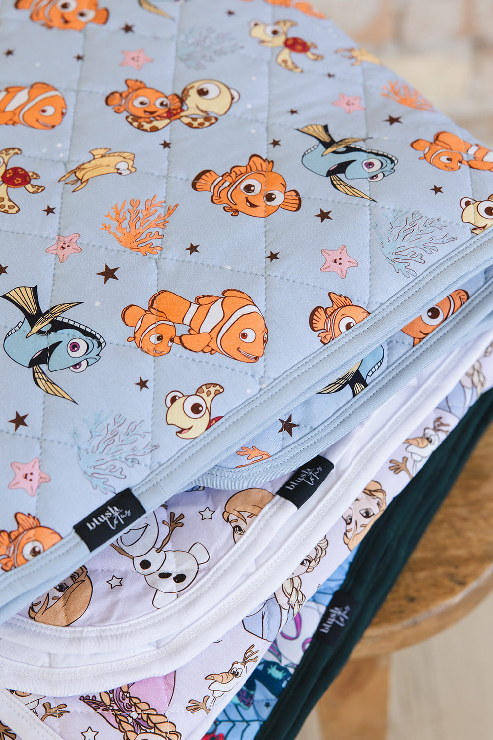 Quilted baby blanket from Lost & Found, perfect for cozy bedding and sleep.