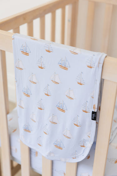Lightweight sailboat blanket for babies, perfect for swaddling and keeping little ones cozy.