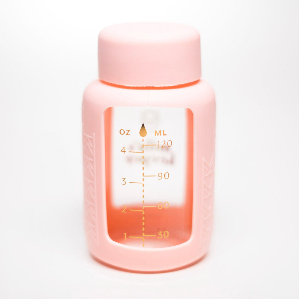 Set of 2 glass breast milk bottles for safe and stylish breast milk storage.