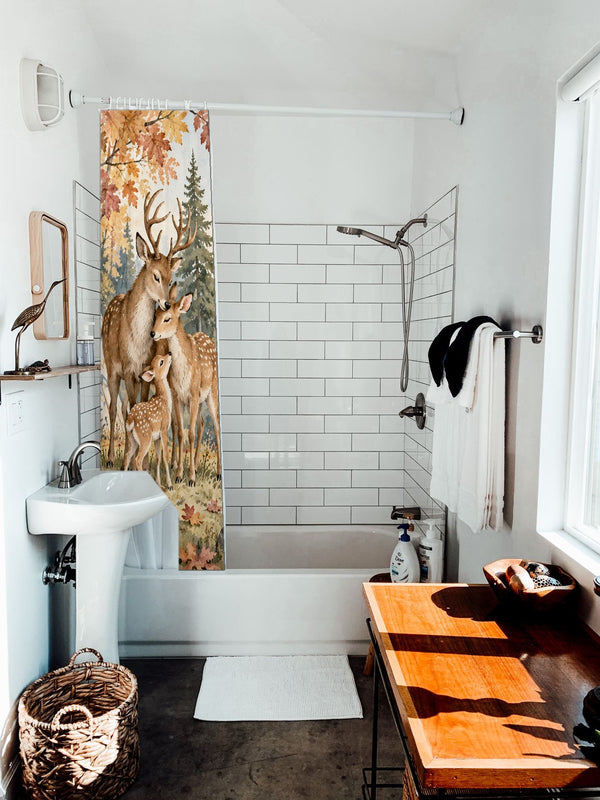 Deer Teepee Camping shower curtain hanging on the rod over a white bathtub