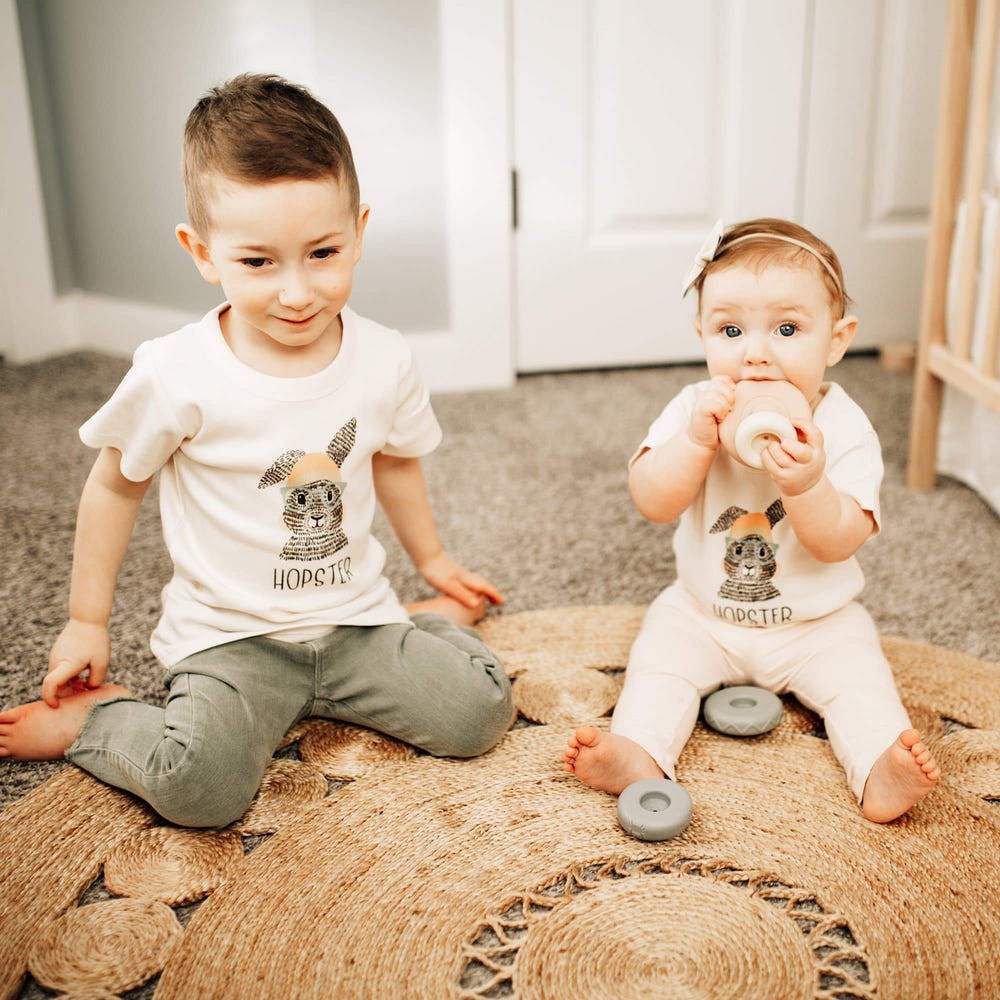 Graphic bodysuit by Hopster for babies, featuring a fun design and short sleeves, perfect for everyday wear.