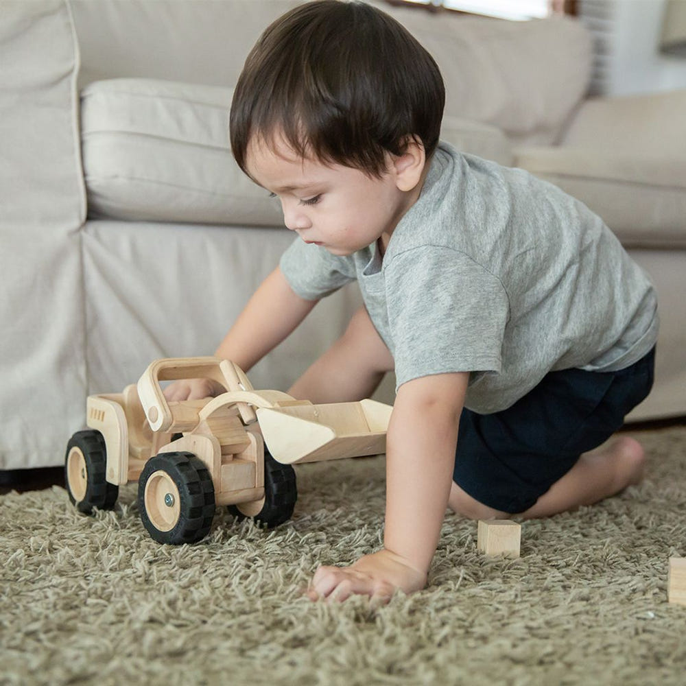 Bright yellow bulldozer toy for imaginative play, perfect for toddlers and preschoolers.