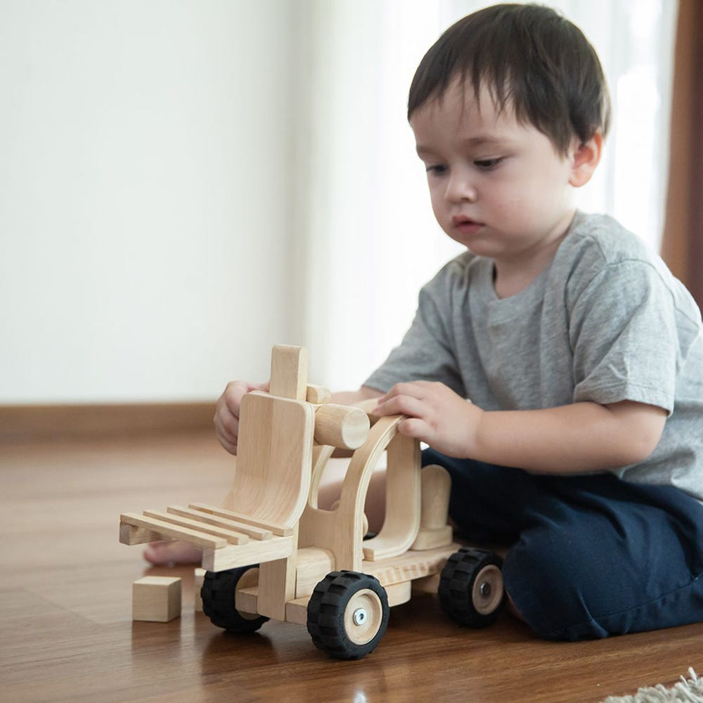 Colorful toy forklift for imaginative pretend play, perfect for little builders and creative playtime adventures.