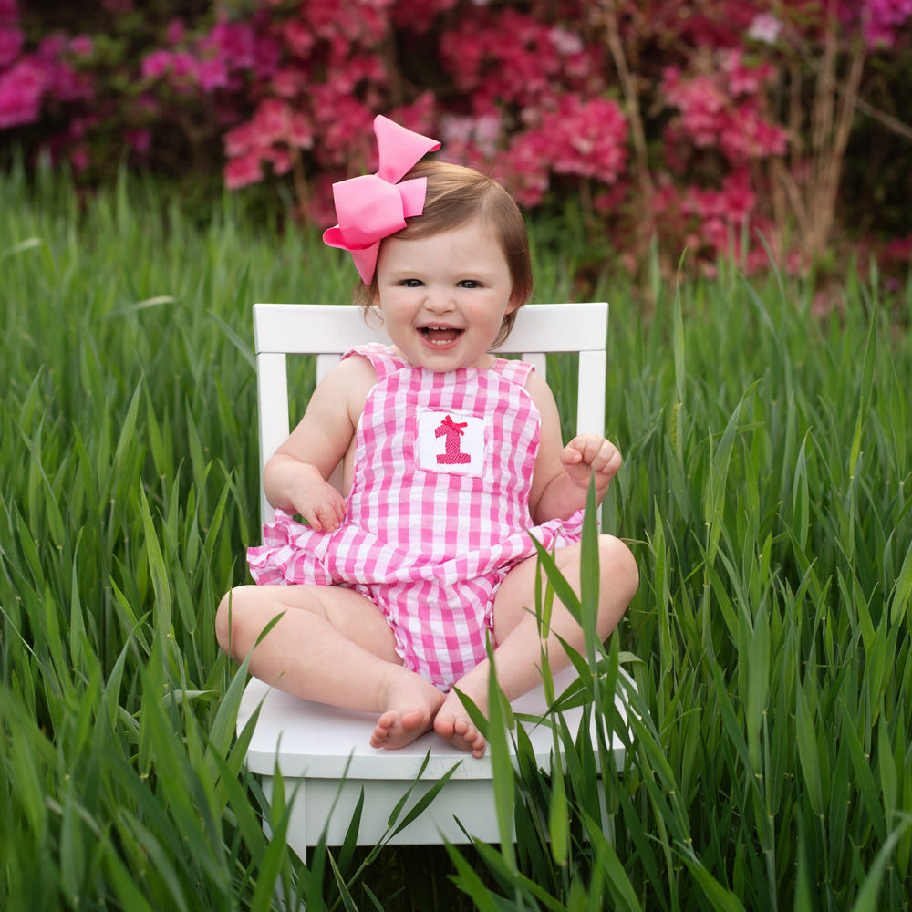 Hot pink first birthday bubble for girls, perfect for celebrating a special milestone in style.
