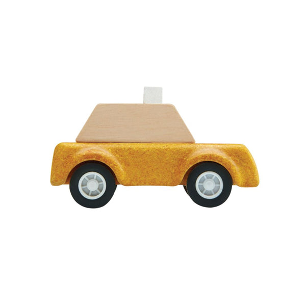 Yellow taxicab toy for babies, perfect for imaginative play and entertainment. Angle view showcasing vibrant design.