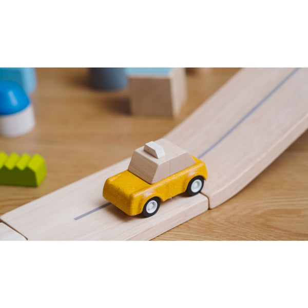Yellow taxicab toy for babies, perfect for imaginative play and entertainment. Angle 3 view showcasing its vibrant design.