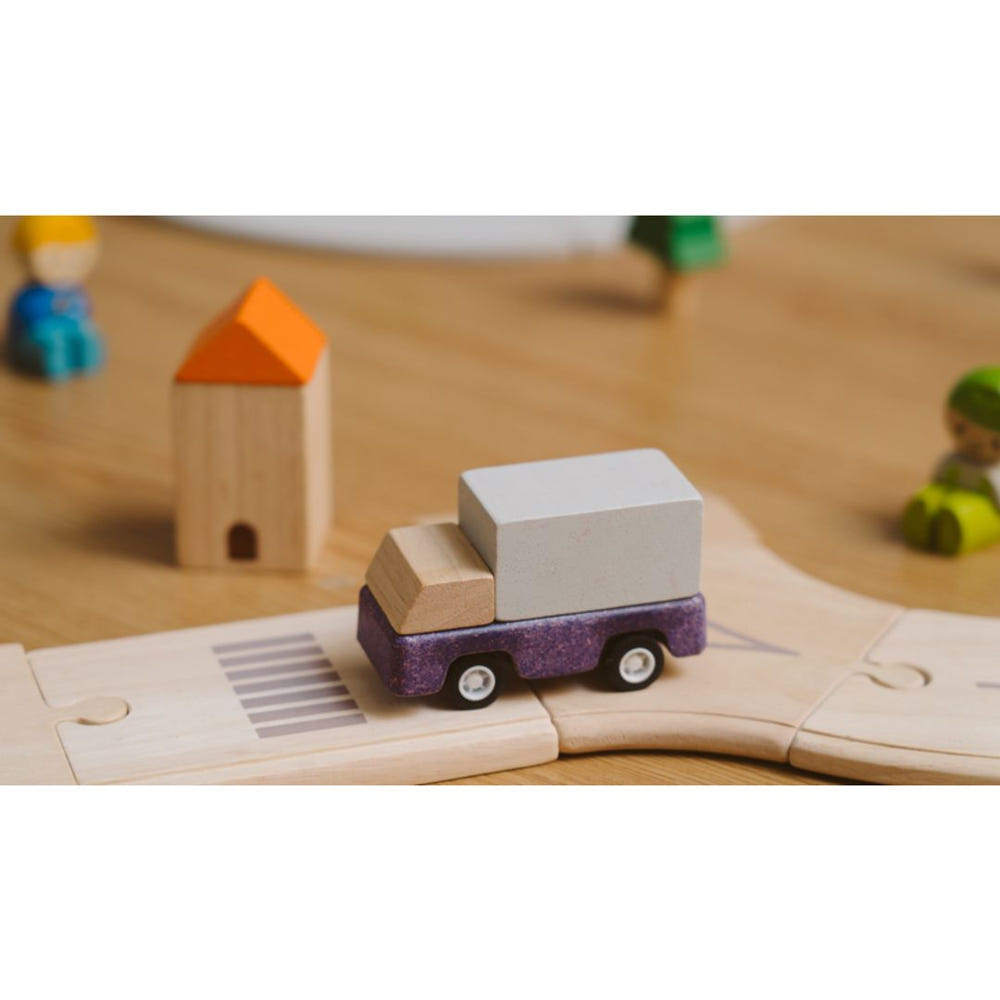 Purple delivery truck toy for babies, perfect for imaginative play and entertainment.
