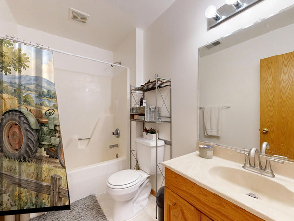 Farm Tractor shower curtain on a tub shower combo in an American family bathroom