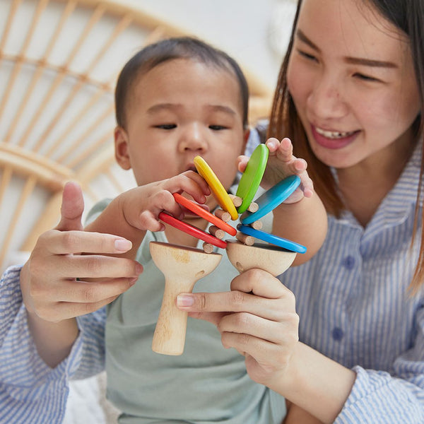 Colorful Clatter toy for babies, promoting early learning and sensory play, viewed from angle 3.