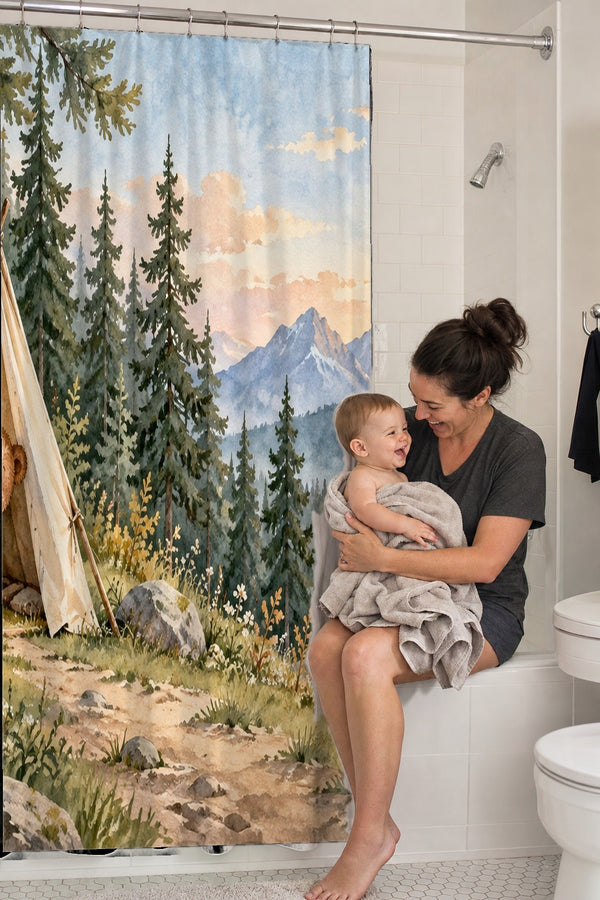 Mom holding her baby on the tub edge next to the Bear Tent Sunrise Camping shower curtain