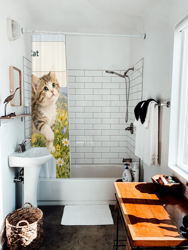 C is for Cat Alphabet shower curtain hanging on the rod over a white bathtub