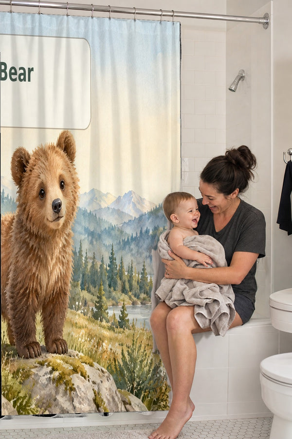 Mom holding her baby on the tub edge next to the B is for Bear Alphabet shower curtain